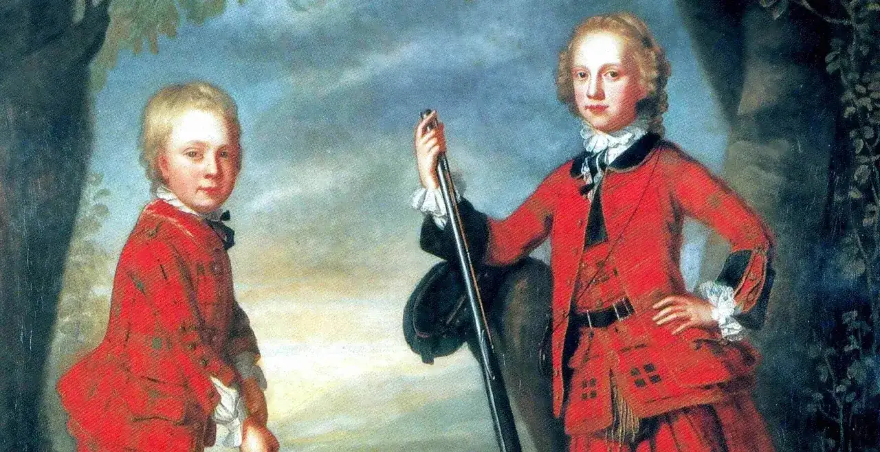 Två pojkar i röda dräkter, en håller en klubba, en tidig bild av golf historia.